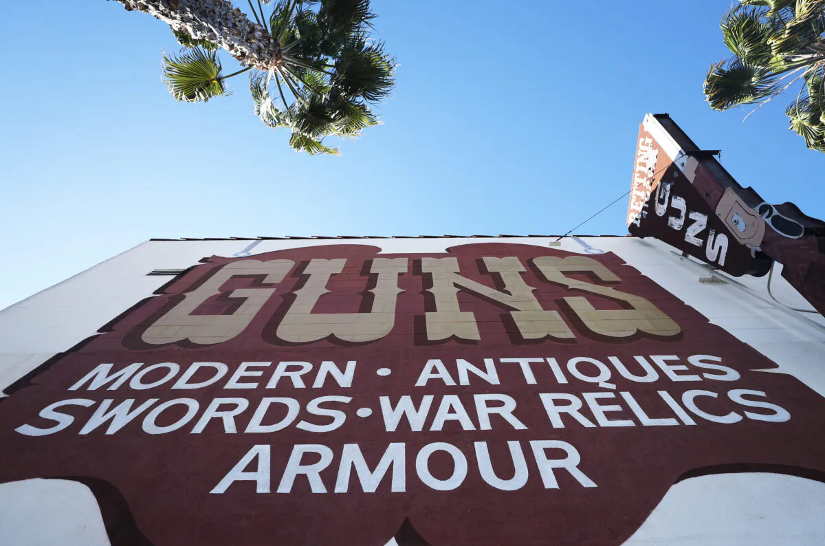 A sign is posted at the Martin B. Retting, Inc. guns store as the coronavirus pandemic continues on March 24, 2020 in Culver City, California. (Mario Tama/Getty Images)