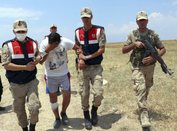 Paramilitary police detain a man in Lake Van, in eastern Turkey, on July 1, 2020.