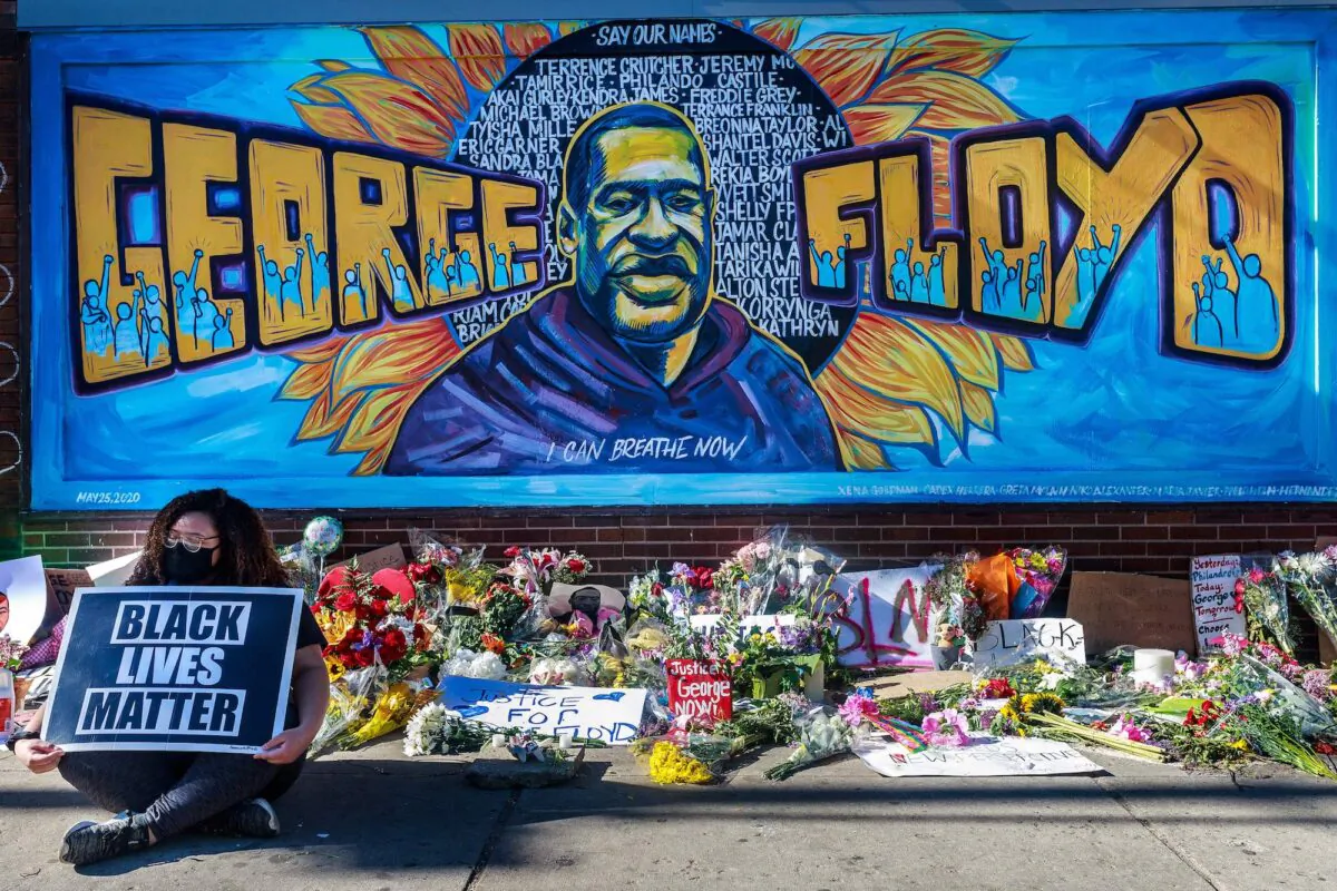Flowers, signs and balloons are left near a makeshift memorial to George Floyd near the spot where he died in Minneapolis, Minnesota. (Kerem Yucel/AFP via Getty Images)