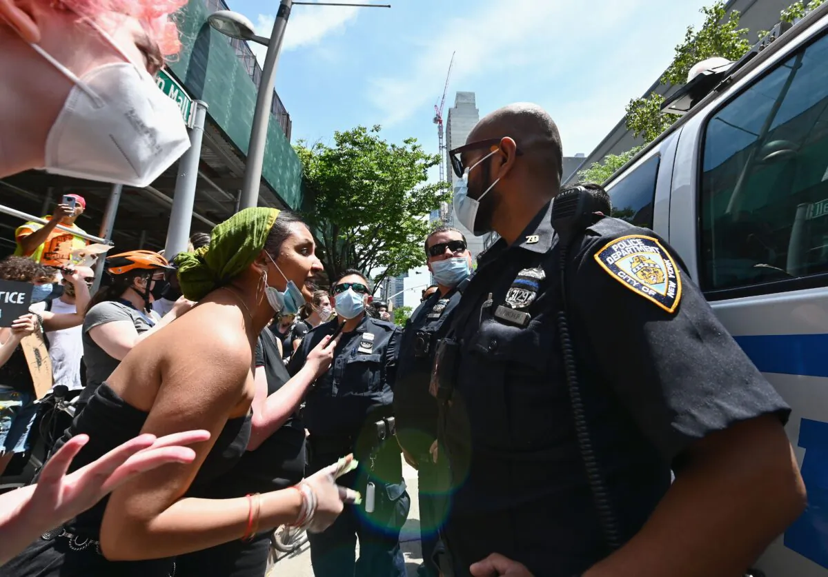 Protesters face off with NYPD officers in Brooklyn, N.Y., on June 17, 2020. (Angela Weiss/AFP via Getty Images)