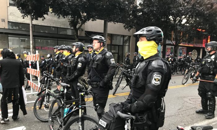 Seattle police block a street with their bikes in the Capitol Hill Organized Protest zone in Seattle on July 1, 2020. (Aron Ranen/AP Photo)