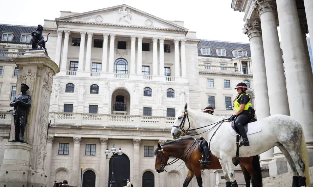 Mounted police officers sit in outside the Royal Exchange and the Bank of England in London, on June 17, 2020. (Tolga Akmen/AFP via Getty Images)