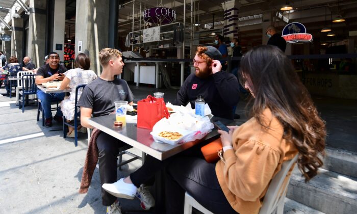 In this file photo, people enjoy outdoor dining in Los Angeles, Calif., on July 1, 2020. (Frederic J. Brown/AFP via Getty Images)