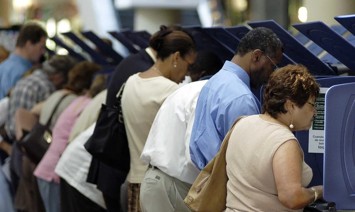 Voters go to the polls for early voting at the Miami-Dade Government Center in Miami, Fla., on Oct. 21, 2004. (G. De Cardenas/Getty Images)