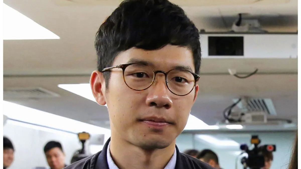 Pro-democracy activist Nathan Law, along with Agnes Chow and Joshua Wong, attends a press conference in Hong Kong on Jan. 27, 2018. (Kin Cheung/AP Photo)