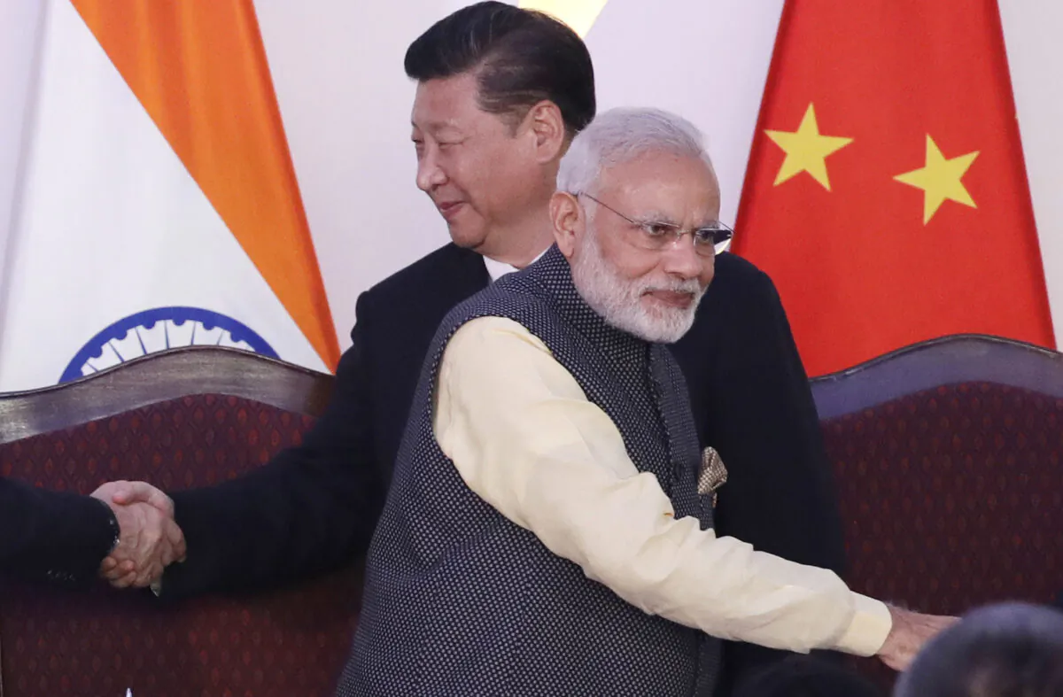  Indian Prime Minister Narendra Modi (F) and Chinese leader Xi Jinping greet leaders at the BRICS summit in Goa, India, on Oct. 16, 2016. (Manish Swarup/File/AP Photo)