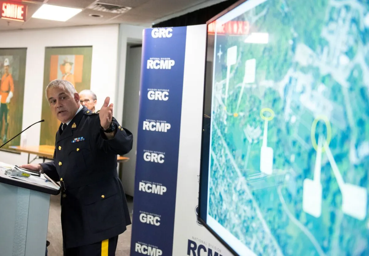 RCMP Deputy Commissioner Mike Duheme points toward a map with timestamps indicating the path of Corey Barclay Hurren, who breached the gates of Rideau Hall on the morning of July 2, during a news conference at the RCMP National Division in Ottawa on July 3, 2020.  (The Canadian Press/Justin Tang)