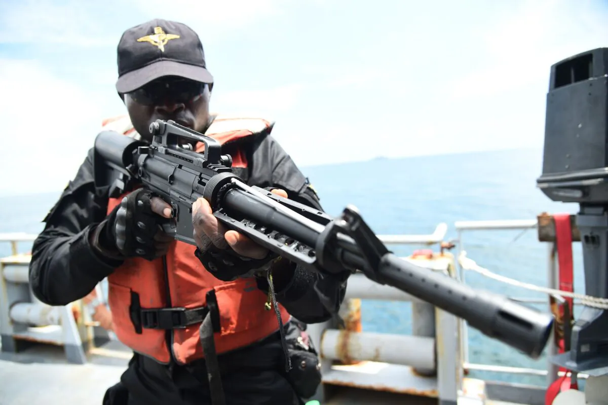 A Special Force of the Nigerian navy tries to arrest pirates in F735 Germinal French Frigate in a stage managed operations during the five-day joint military exercise between Nigeria and French navy codenamed Grand African NEMO (Navy Exercise Maritime Operations) in Nigerian waters on November 1, 2019. (Pius Utomi Ekpei/ AFP via Getty Images)