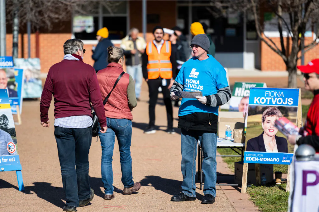 The rural seat of Eden-Monaro is holding a by-election. Voters and party representatives interact outside Bungendore Public School on July 04, 2020 in Bungendore, Australia. (Rohan Thomson/Getty Images)