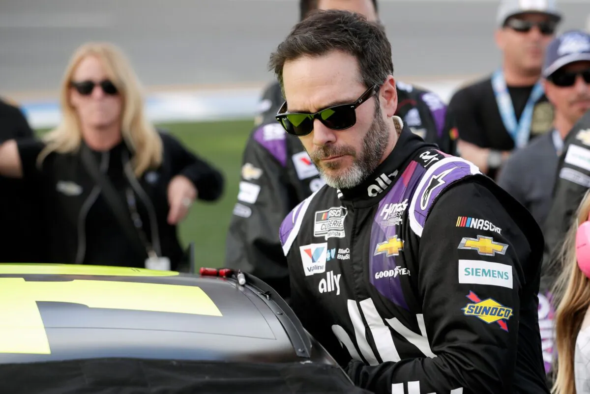 Jimmie Johnson climbs into his car before the NASCAR Daytona 500 auto race at Daytona International Speedway in Daytona Beach, Fla., on Feb. 16, 2020. (John Raoux/AP Photo)