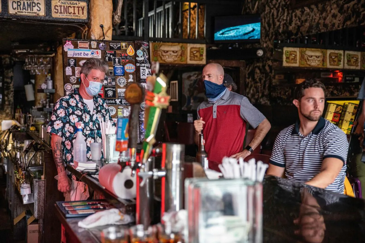 People sit at the bar of a restaurant in Austin, Texas, on June 26, 2020. (Sergio Flores/AFP via Getty Images)