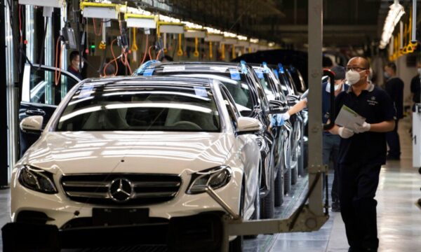 Workers at Beijing Benz Automotive Co.