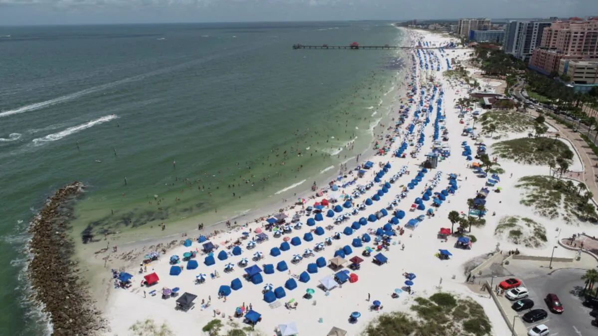 Sun seekers gather at Clearwater Beach in Clearwater, Fla, on July 4, 2020. (Drone Base/Reuters)