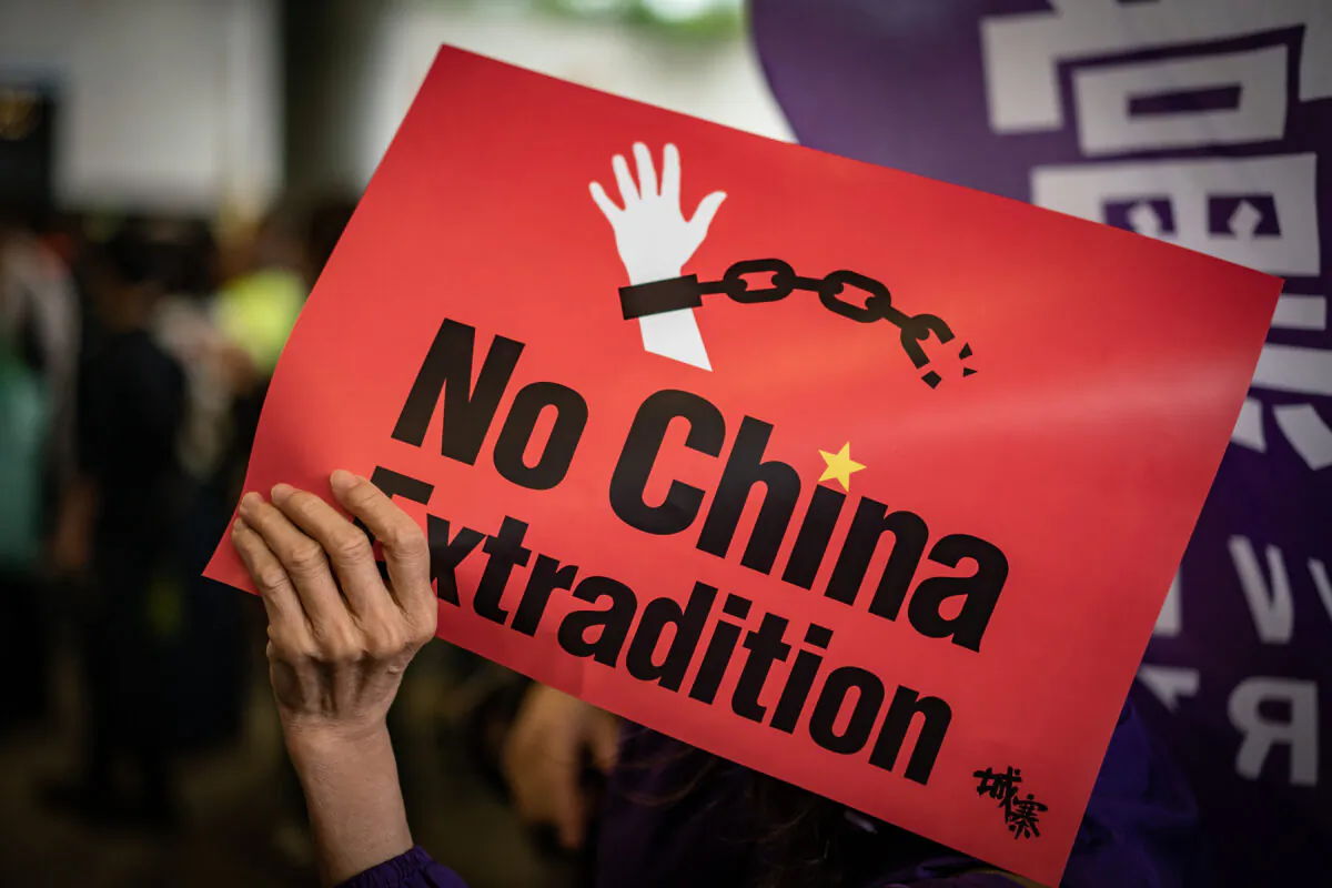 A protester holds a placard during a rally against the extradition law outside the Legislative Council building in Hong Kong, China, on May 4, 2019. (Anthony Kwan/Getty Images)