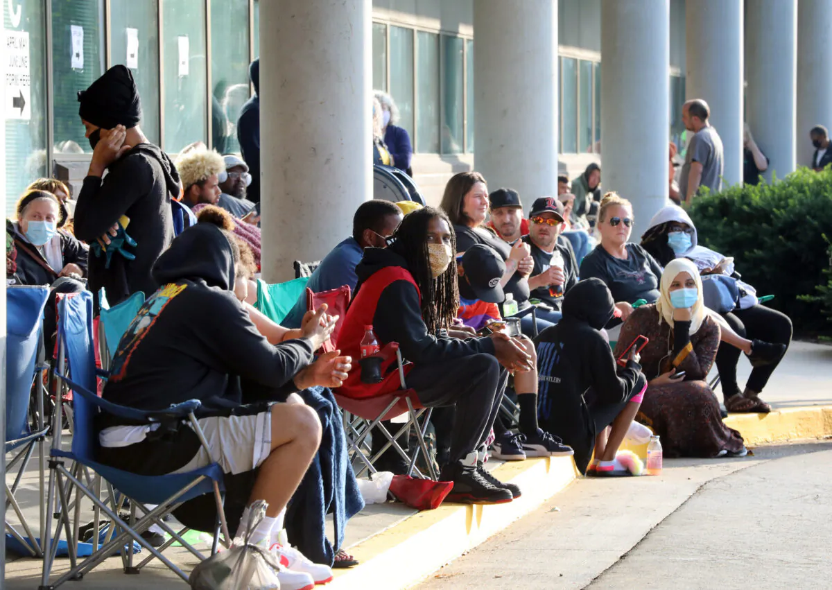 Hundreds of unemployed Kentucky residents wait in long lines outside the Kentucky Career Center on June 19, 2020 in Frankfort, Kentucky. (John Sommers II/Getty Images)