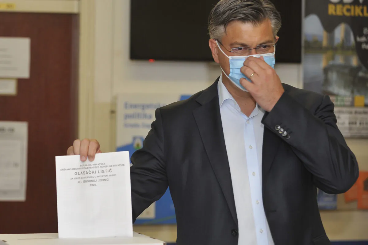 Andrej Plenkovic, Croatia's Prime Minister incumbent casts his ballot at a polling station in Zagreb, Croatia, on July 5, 2020. (AP Photo)