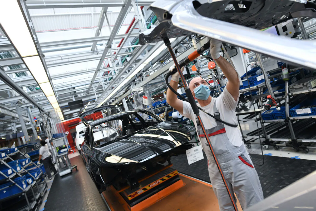 An employee works at the A3 and A4 production line of the German car manufacturer Audi, amid the spread of the coronavirus disease (COVID-19) in Ingolstadt, Germany, June 3, 2020. (Andreas Gebert/Reuters)