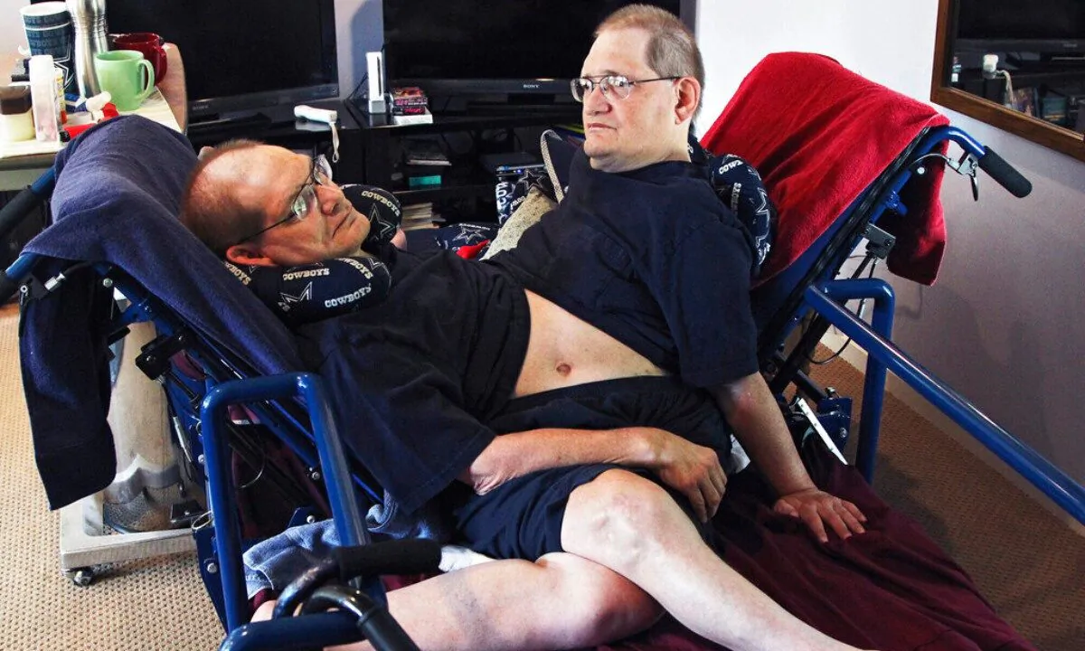 Donnie, (L), and Ronnie Galyon sit inside their Beavercreek, Ohio, home, on July 2, 2014. (Drew Simon/Dayton Daily News via AP, File) 