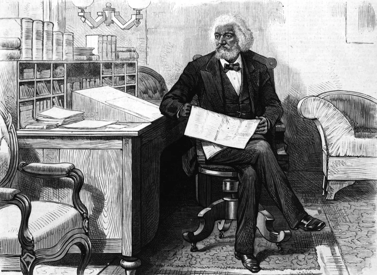 American orator, editor, author, abolitionist, and former slave Frederick Douglass (1818 - 1895) edits a journal at his desk in the late 1870s. (Hulton Archive/Getty Images)