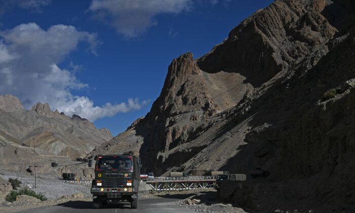 A military convoy drives towards Leh along the Srinagar-Leh Highway on June 29, 2020. (Tauseef Mustafa/AFP via Getty Images)