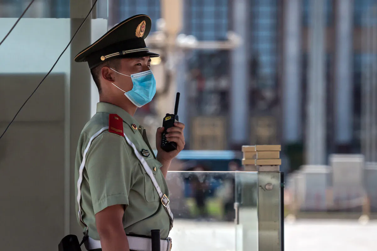 A paramilitary policeman stands guard on Tiananmen Square in Beijing on June 4, 2020. (Nicolas Asfouri/AFP via Getty Images)
