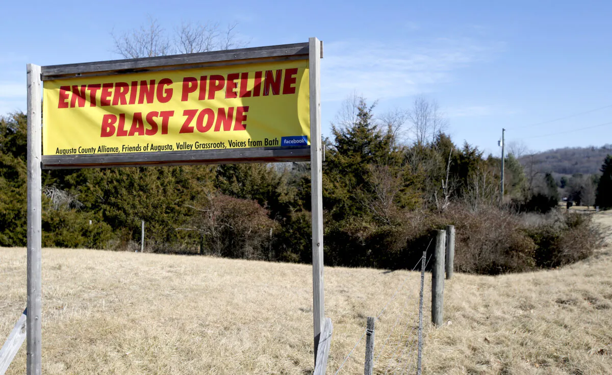 A sign along a highway protests the route of the Atlantic Coast Pipeline in Deerfield, Va., on Feb. 8, 2018. (Steve Helber/AP Photo)