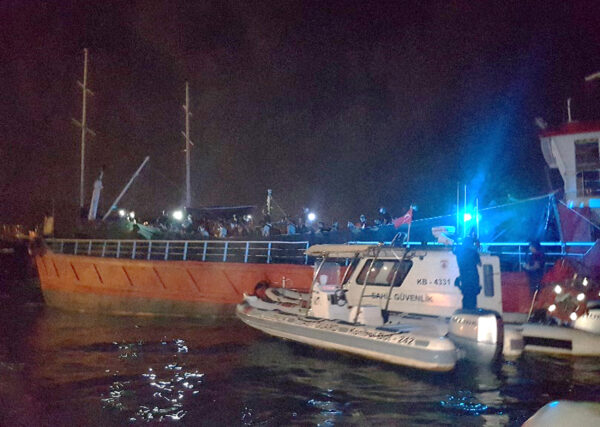 A Turkish Coast Guard Command boat is seen next to cargo ship during a raid in the Aegean port city of Izmir, Turkey, July 7 2020. (Turkish Coast Guard Command/Handout via Reuters)