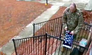 Touching Video Captures a Soldier Folding a Fallen American Flag Outside Stranger's House