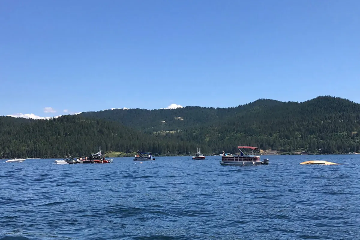 Boaters flag down authorities to a crashed seaplane near Powderhorn Bay on Lake Coeur d'Alene in Idaho on July 5, 2020 (Stephanie Hammett/The Spokesman-Review via AP)