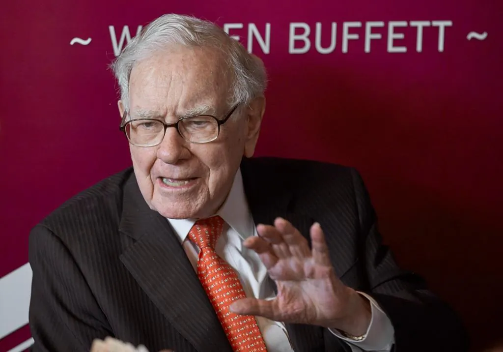 Warren Buffett, Chairman and CEO of Berkshire Hathaway, speaks during a game of bridge following the annual Berkshire Hathaway shareholders meeting in Omaha, Neb., May 5, 2019. A new report is holding up legendary investor Buffett's decision to walk away from a proposed liquefied natural gas project in Quebec in March as one sign that the LNG sector in Canada and elsewhere is on shaky ground. (Nati Harnik/The Canadian Press via AP)