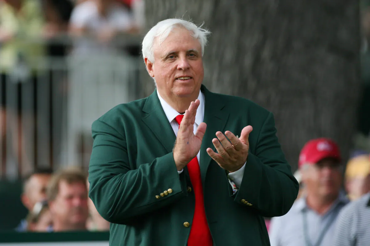 Jim Justice, owner of The Greenbrier Resort, applauds on the 18th tee during the final round of The Greenbrier Classic at The Old White TPC in White Sulphur Springs, W. Va., on July 31, 2011. (Hunter Martin/Getty Images)