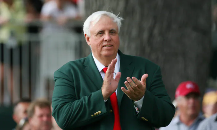 Jim Justice, owner of The Greenbrier Resort, applauds on the 18th tee during the final round of The Greenbrier Classic at The Old White TPC in White Sulphur Springs, W. Va., on July 31, 2011. (Hunter Martin/Getty Images)