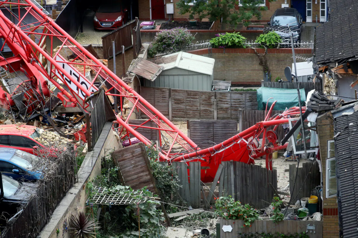 A collapsed crane is seen near a construction site in Bow, east London, Britain, on July 8, 2020. (Hannah McKay/Reuters)