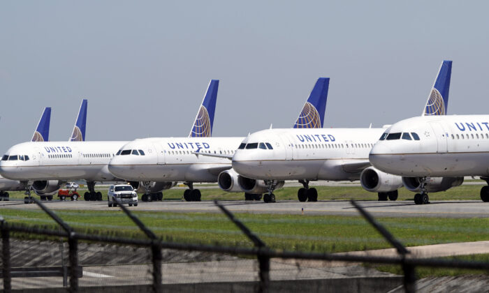 United Airlines planes are parked at George Bush Intercontinental Airport in Houston, Texas, on March 25, 2020. (David J. Phillip/AP)