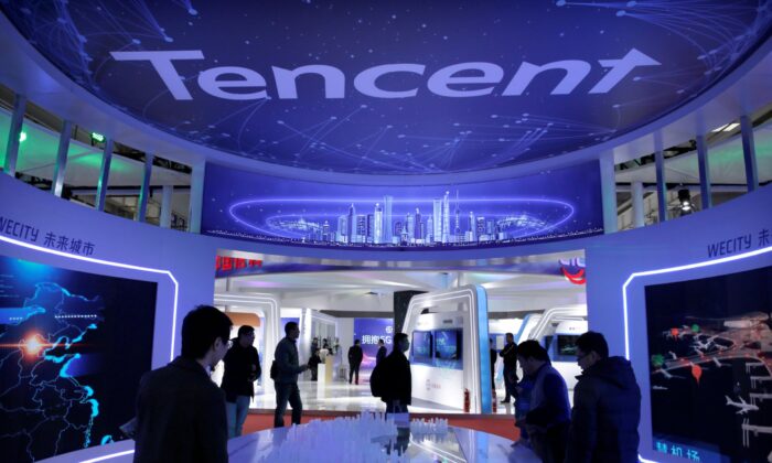 People visit Tencent's booth at the World 5G Exhibition in Beijing on Nov. 22, 2019. REUTERS/Jason Lee