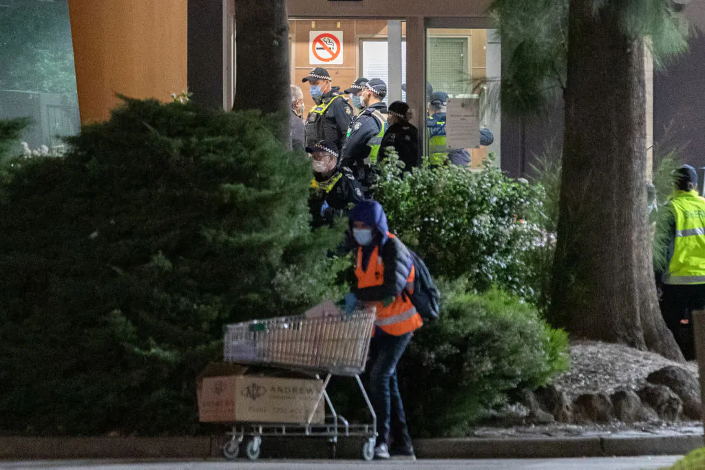 Police are seen in the foyer of the public housing flat at 33 Alfred Street in North Melbourne, which had 53 confirmed cases—about 11 percent of all residents in that tower on July 9, 2020 in Melbourne, Australia. (Asanka Ratnayake/Getty Images)