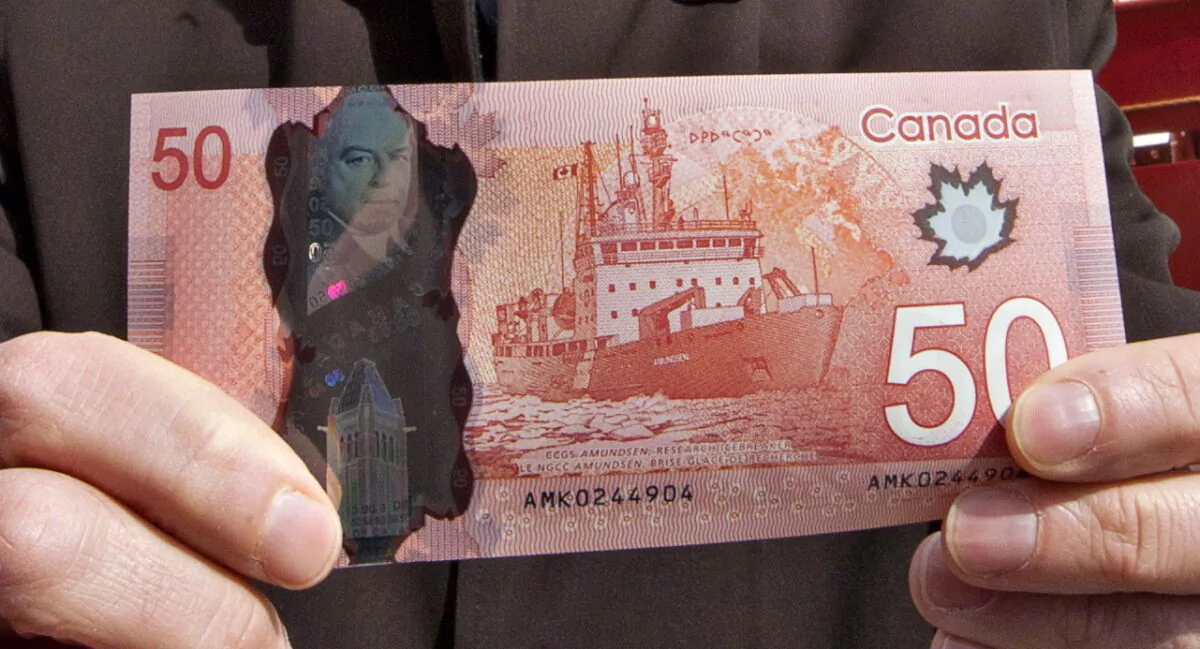 The new polymer $50 bill is pictured on March 26, 2012, the date it went into circulation. (THE CANADIAN PRESS/Jacques Boissinot)