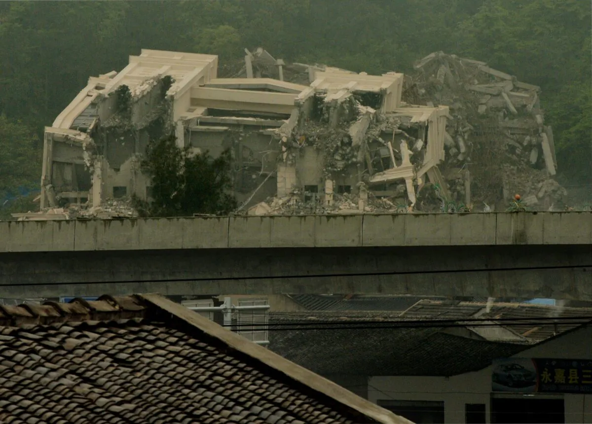 Chinese authorities continue the demolition, started a couple of days earlier, of a Christian church in Oubei town, outside of Wenzhou city, China, on April 30, 2014. (Mark Ralston/AFP via Getty Images)