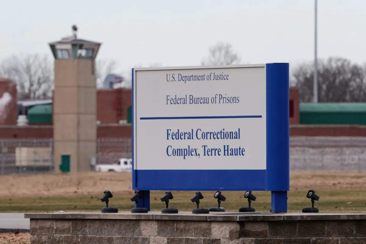 The guard tower flanks the sign at the entrance to the U.S. Penitentiary in Terre Haute, Ind., on Dec. 10, 2019. (Michael Conroy/AP Photo)