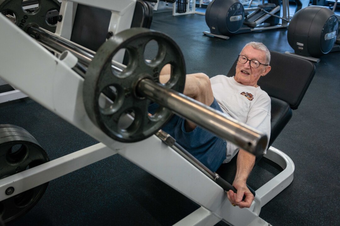 Art Ballard does a leg press. “At my age, the best thing you can do is find a routine.” (Heidi de Marco, KHN)