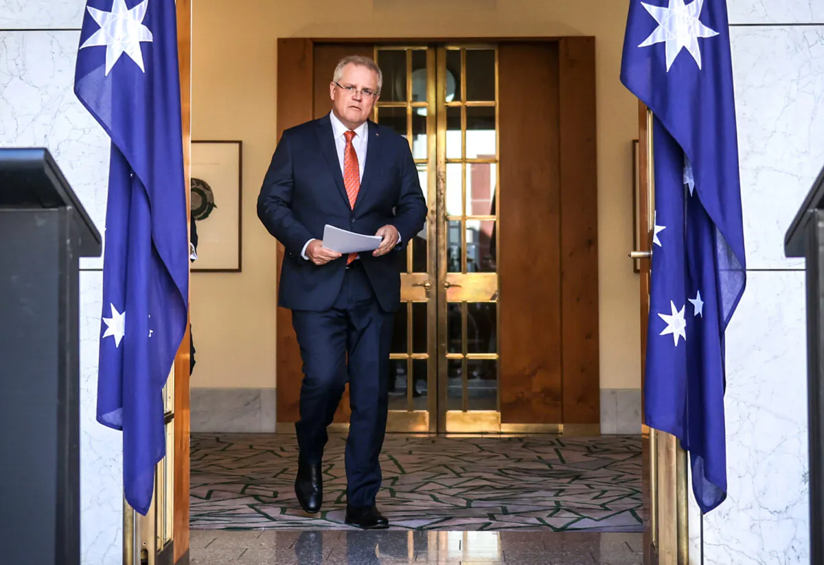 Australian Prime Minister Scott Morrison walks to a media conference at Parliament House in Canberra, Australia, on July 9, 2020. (David Gray/Getty Images)
