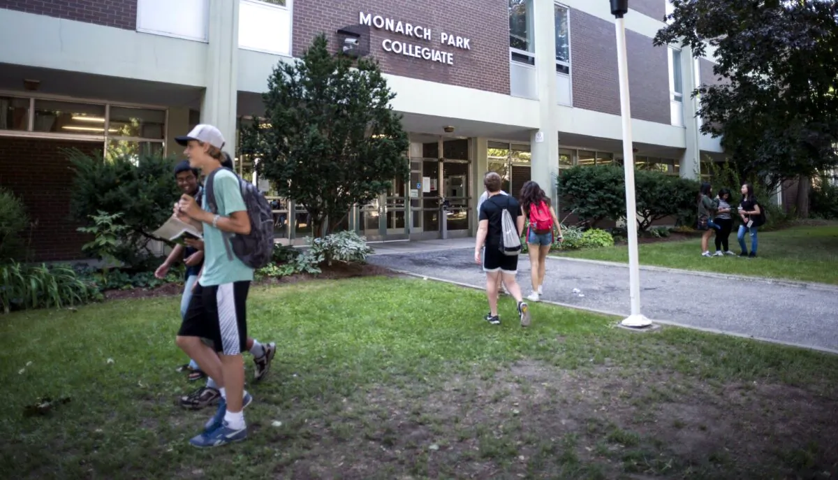 Students arrive at a high school in Toronto in a file photo. Directors of education are the top positions in Ontario school boards. (The Canadian Press/Christopher Katsarov)