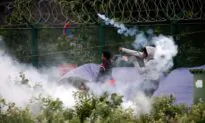 New British-French Deal to Fight ‘Vile People Smuggling’