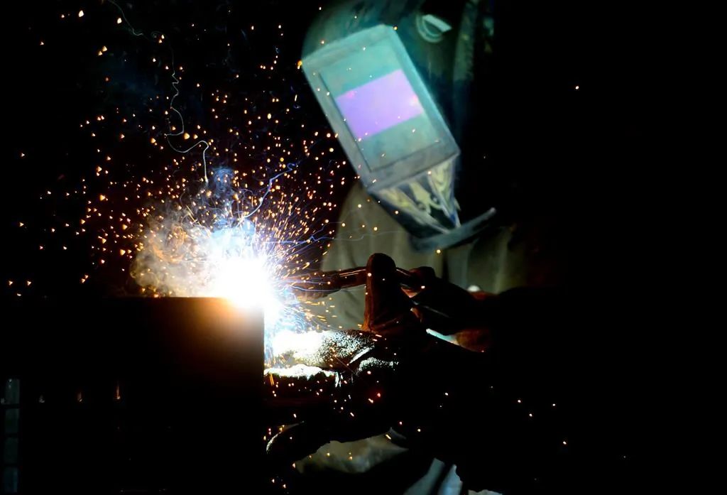 A welder fabricates a steel structure at an iron works facility in Ottawa in a file photo. (The Canadian Press/Sean Kilpatrick)
