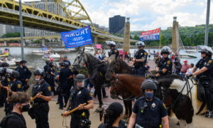 Pennsylvania Police Officer Who Kicked Seated Protester Won't Face Criminal Charges