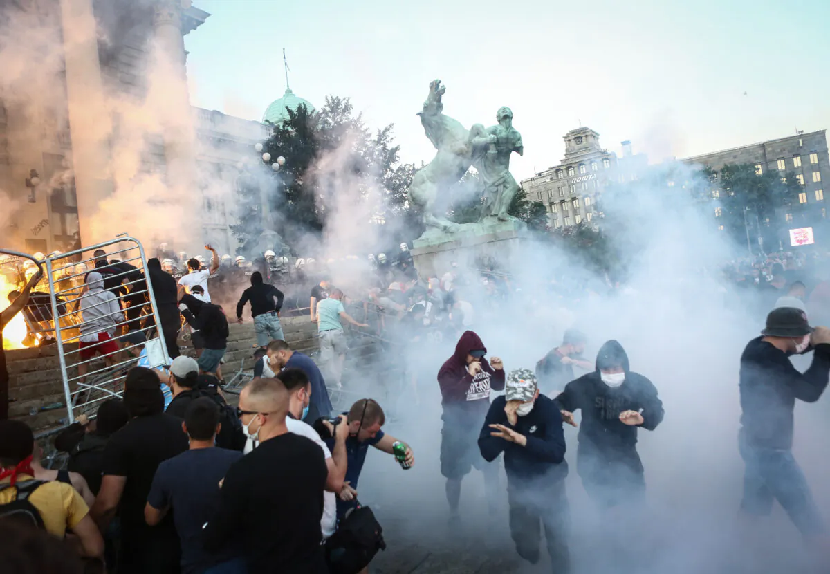 Protesters clash with police in Belgrade on July 8, 2020 (Oliver Bunic/AFP via Getty Images)