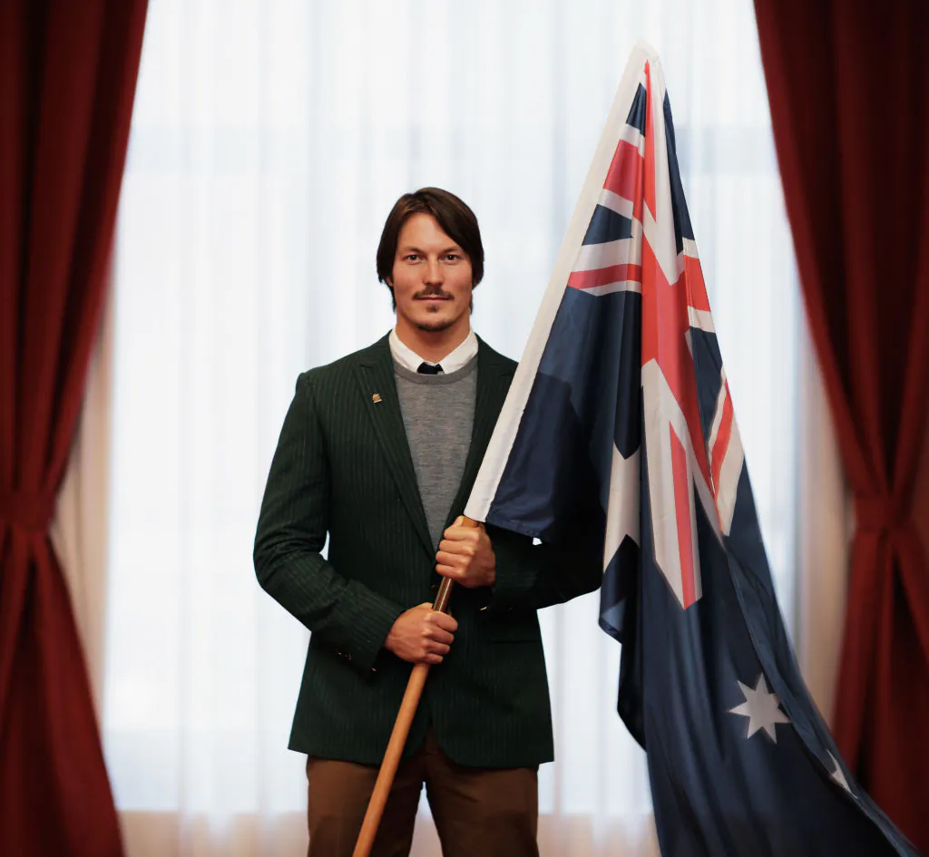 Alex Pullin of Australia poses with the Australian Flag after being announced as the Flag Bearer for Australia at the Sochi Olympics Opening Ceremony at the Golden Tulip Hotel on February 6, 2014 in Sochi, Russia.  (Photo by Adam Pretty/Getty Images)
