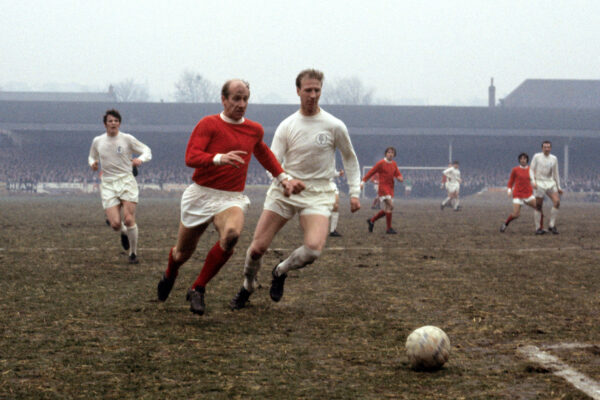 Jack Charlton and his brother Bobby Charlton in a soccer match Leeds
