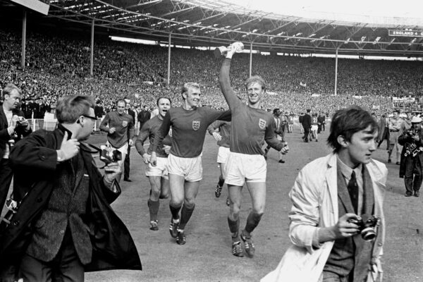Jack Charlton holds the Jules Rimet trophy aloft in 1966 World Cup parades