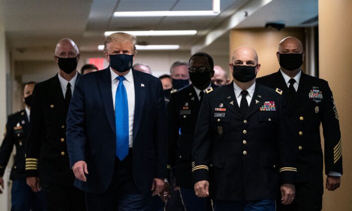President Donald Trump wears a mask as he visits Walter Reed National Military Medical Center in Bethesda, Md., on July 11, 2020. (Alex Edelman/AFP via Getty Images)